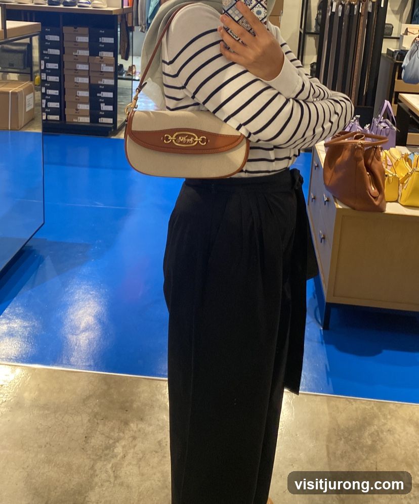 Woman holding a handbag in a store
