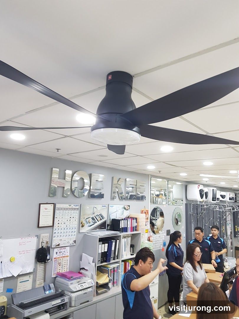 Interior of a store with ceiling fan and staff