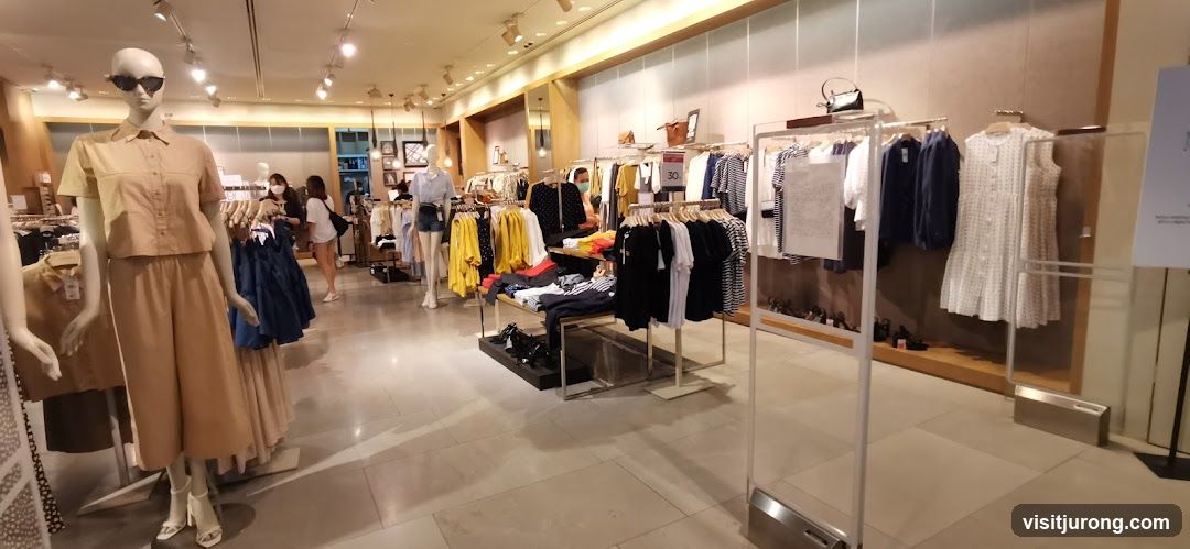 Clothing store interior with mannequins and racks of clothes