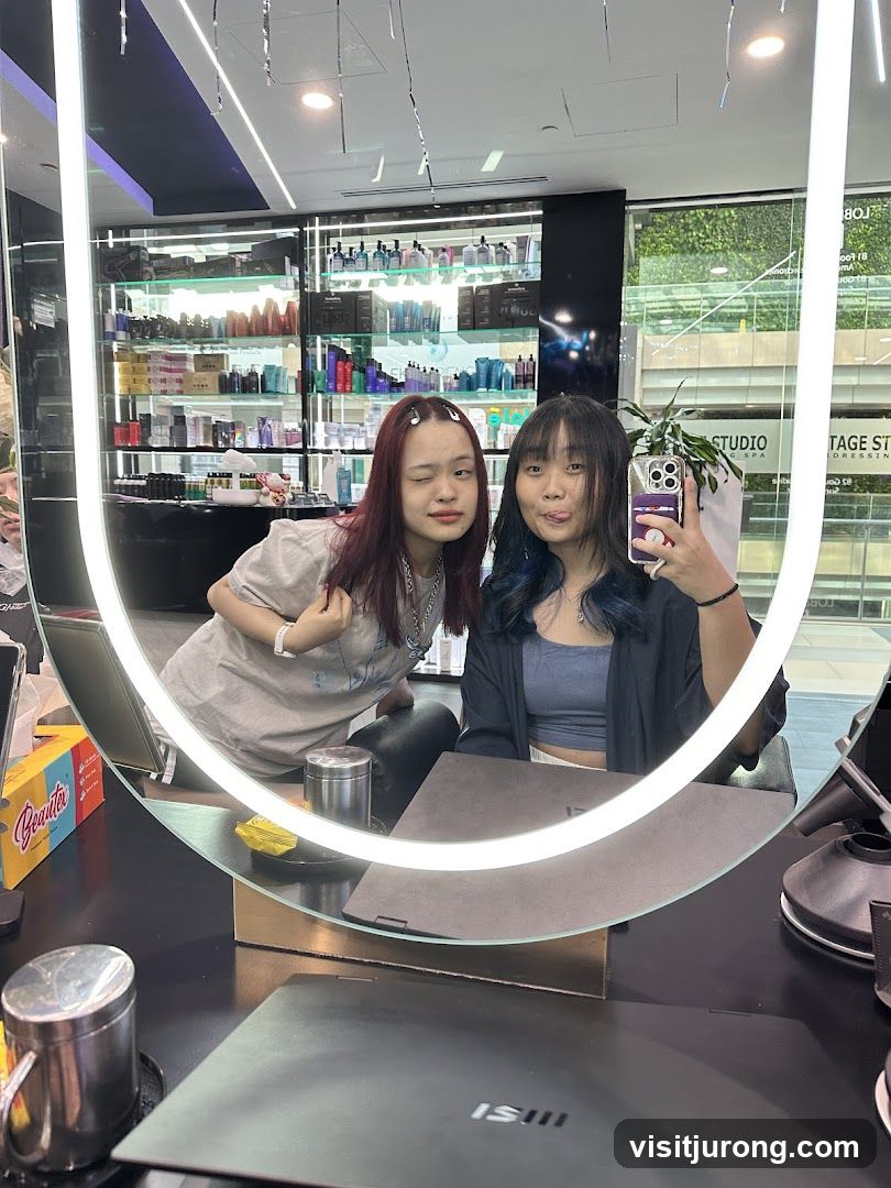 Two young women taking a selfie in a salon