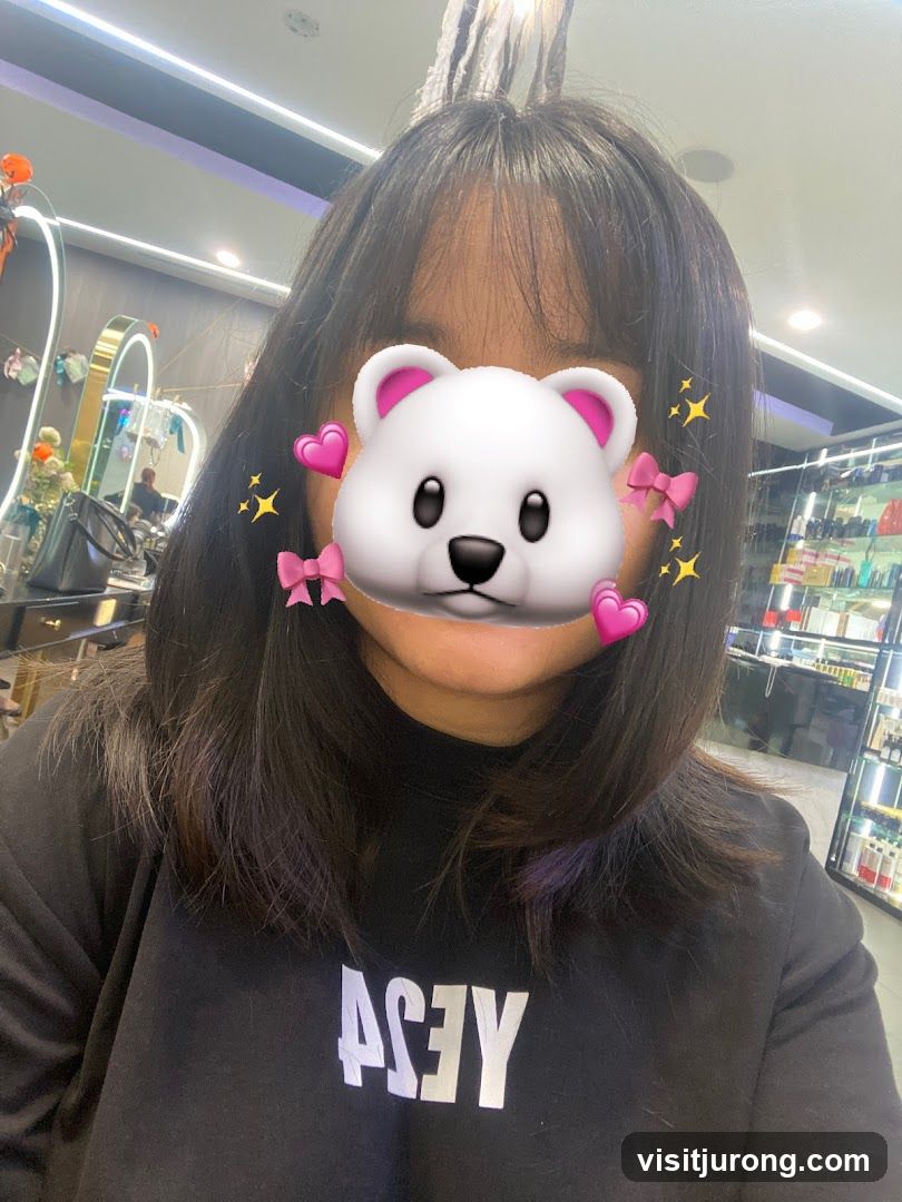 Woman with bear emoji covering face