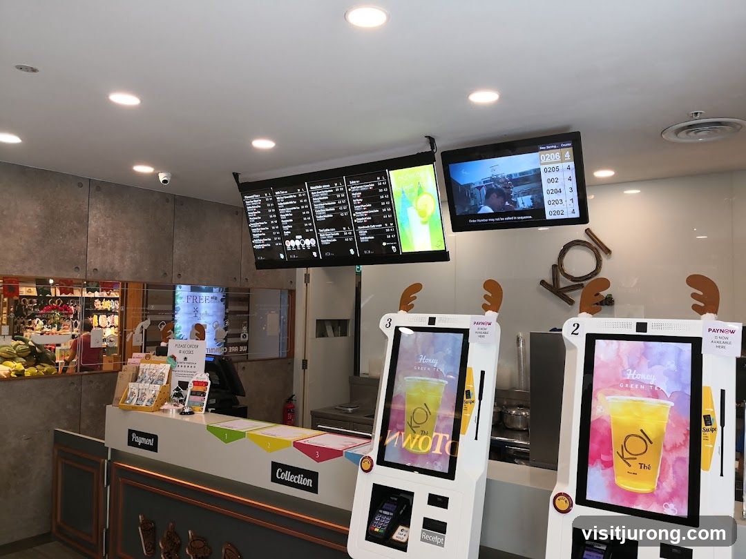 Self-service kiosks and order screens at a beverage shop