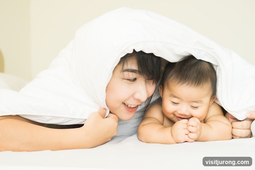 Mother and Baby Under Blanket