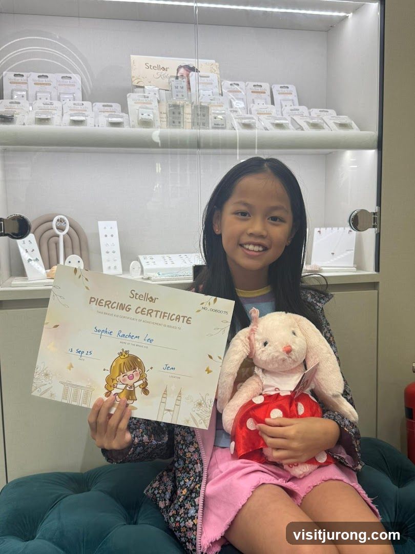 Girl Holding Piercing Certificate and Stuffed Animal