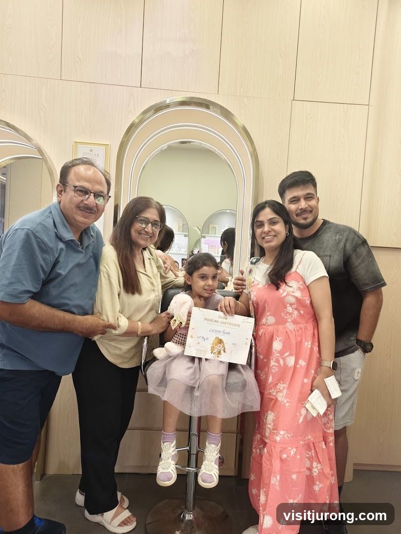 Family Posing with a Certificate