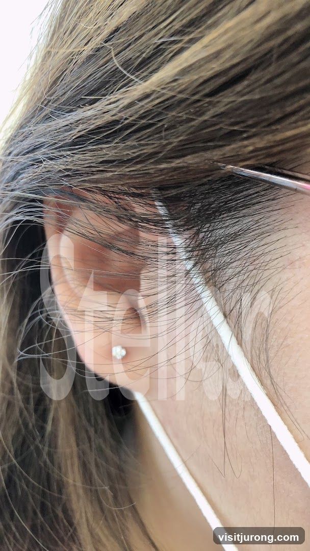 Close-up of Ear with Hair and Mask