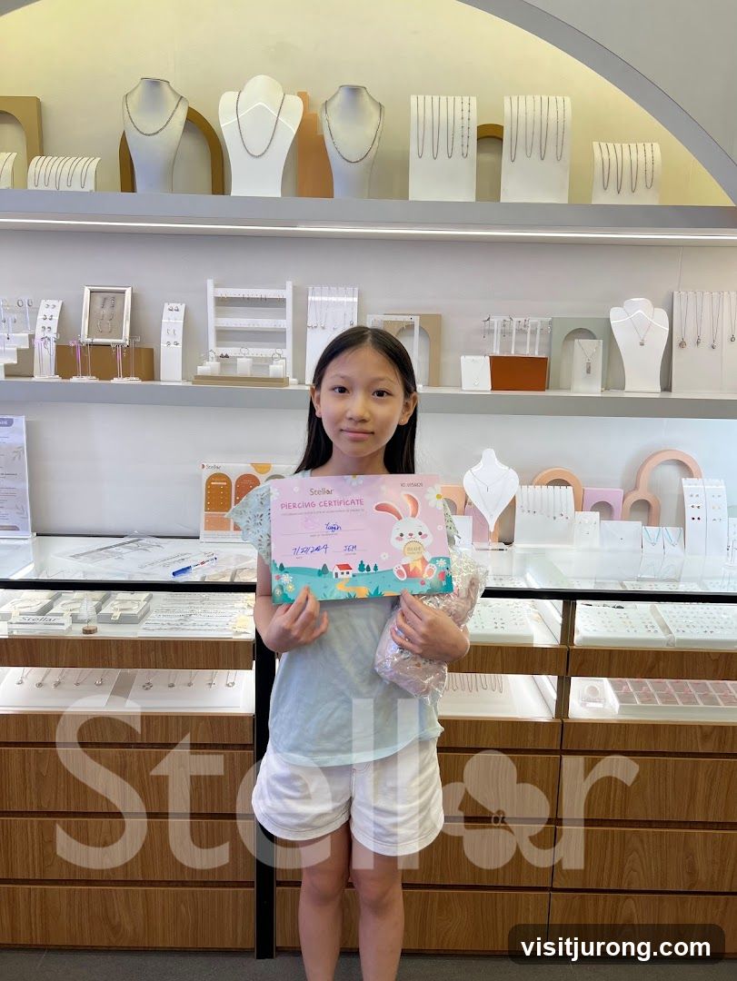 Girl holding a piercing certificate