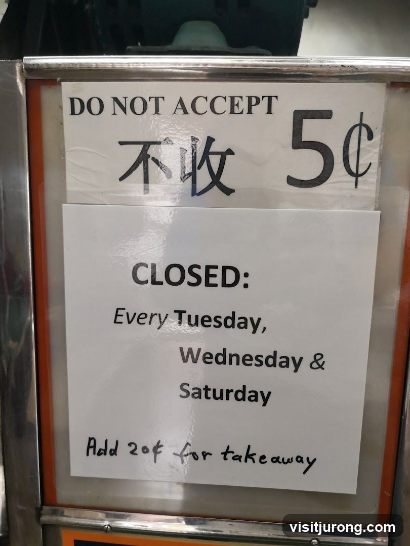 Sign about accepted currency and opening hours