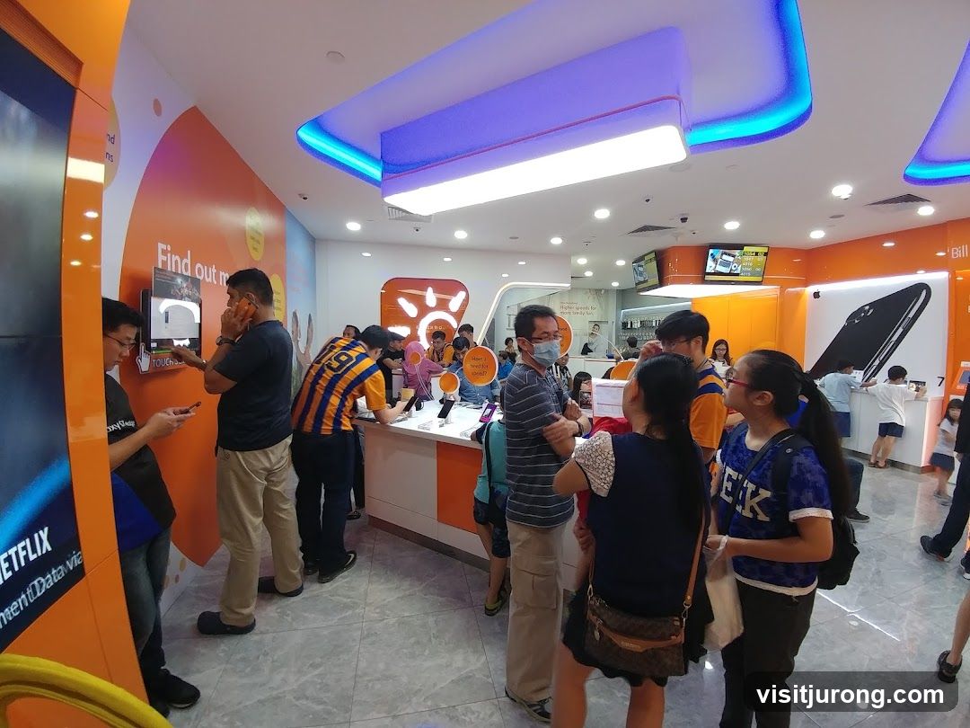 Customers in a brightly lit electronics store
