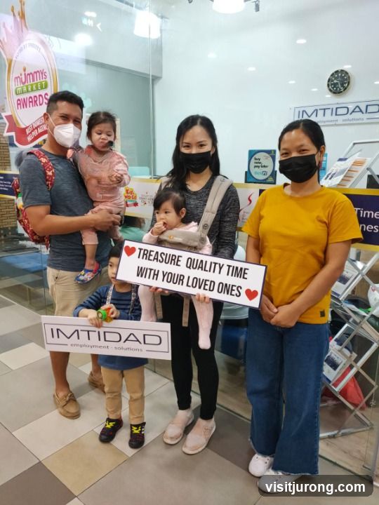 Family holding signs