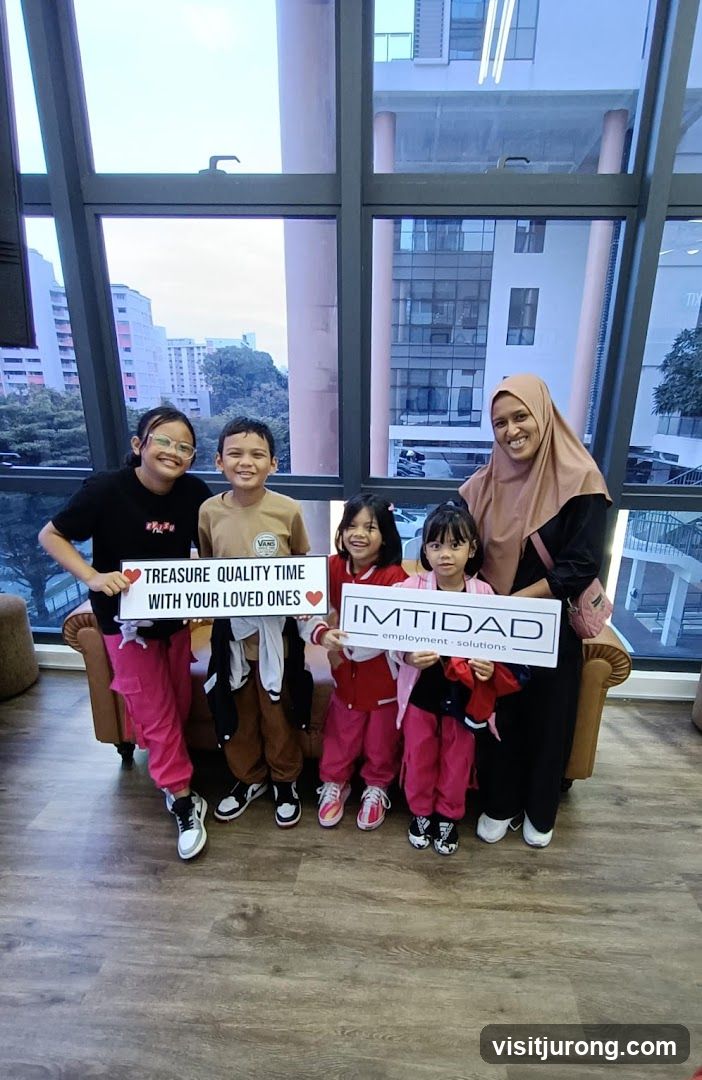Family posing with signs