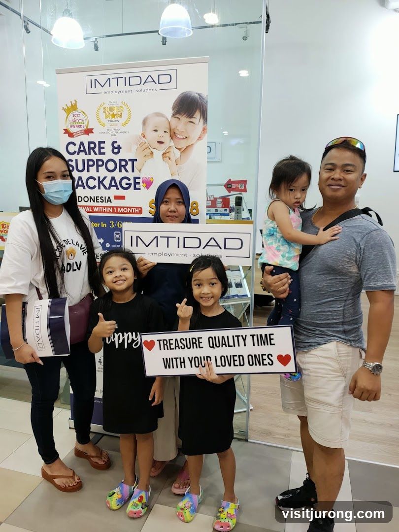 Family Posing with a Banner
