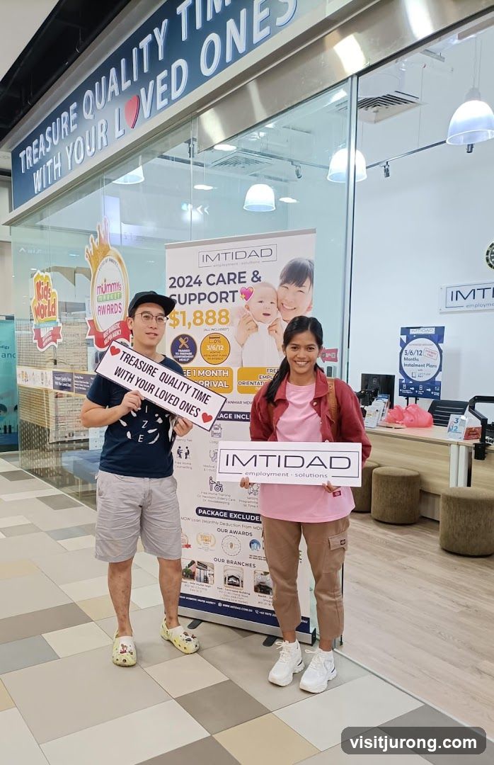 Two people holding signs in front of a business