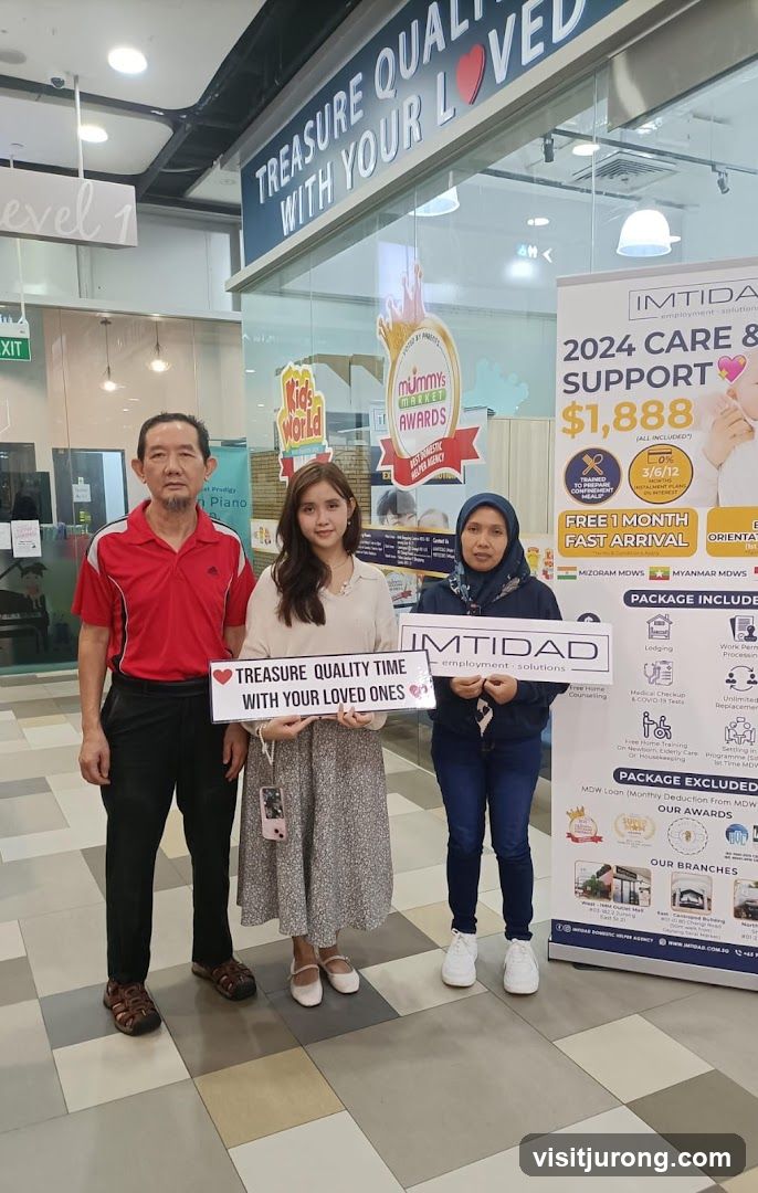 People holding signs in front of a business