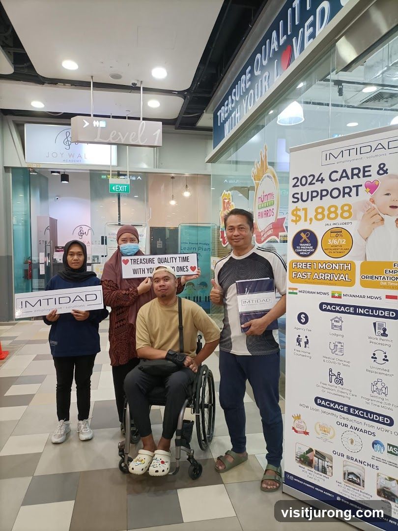 People holding signs and a promotional banner