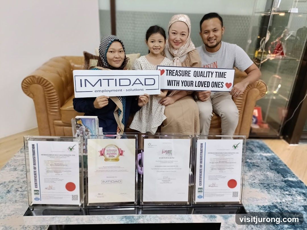 Family holding signs with company logo and slogan