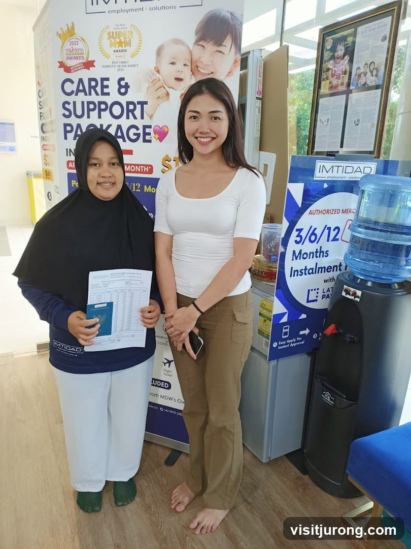 Two women posing with documents