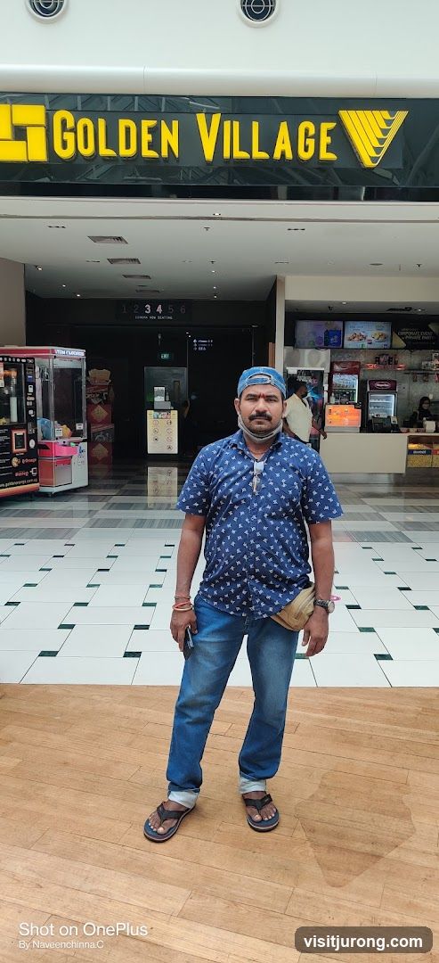 Man in front of Golden Village cinema