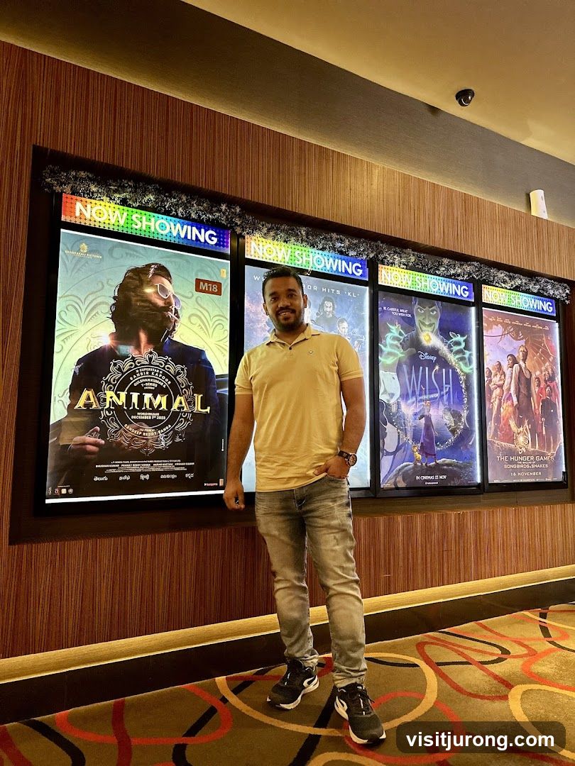 Man Posing in Front of Movie Posters