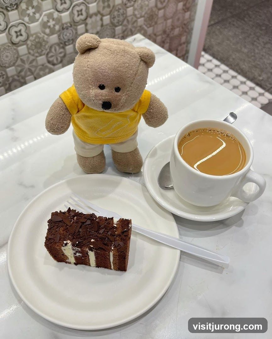 Teddy bear with cake and coffee