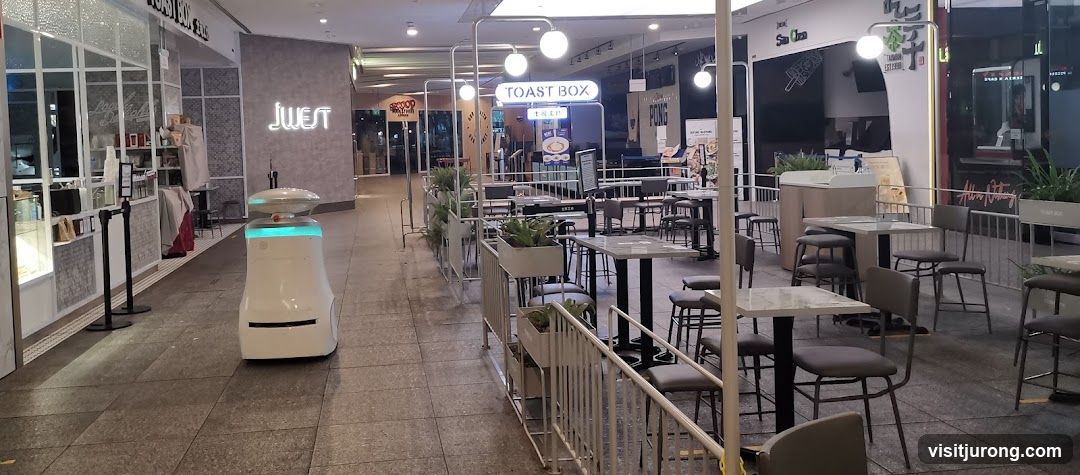 Outdoor seating area with a delivery robot