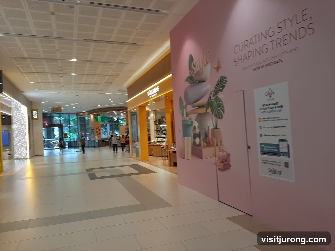 Mall Interior with Storefronts and Advertisement