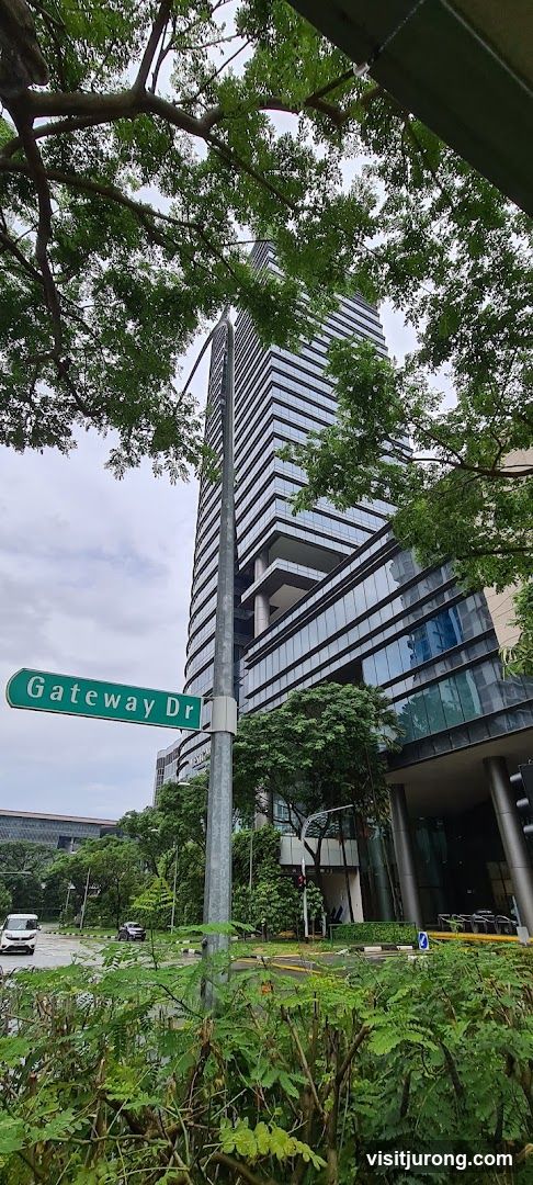 Modern Skyscraper and Street Sign