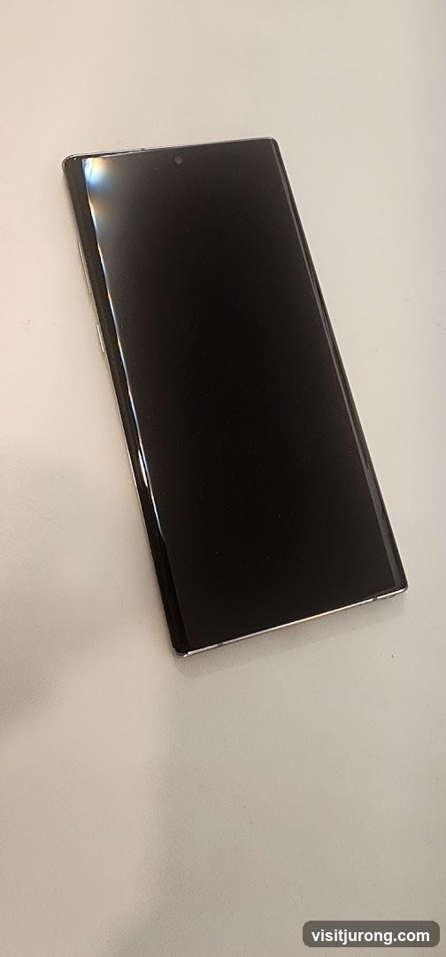 Black smartphone on a white surface