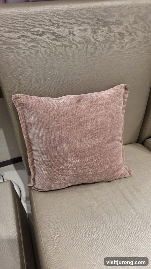 Pink Throw Pillow on Beige Chair