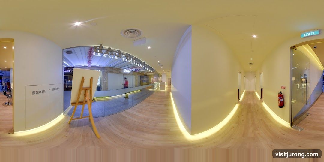 Interior of a modern building with a hallway and storefronts