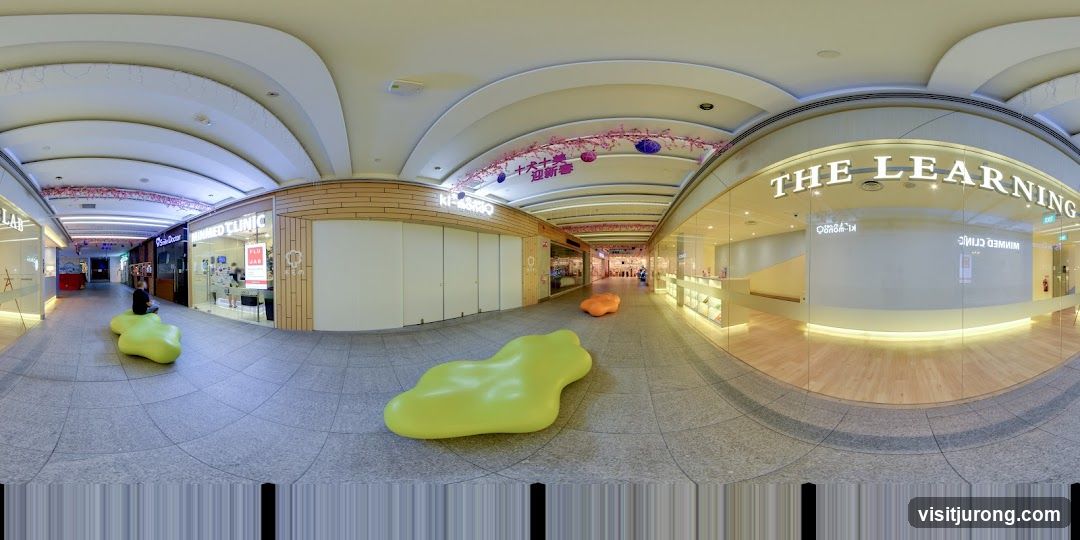 Shopping Mall Interior with Shops and Seating