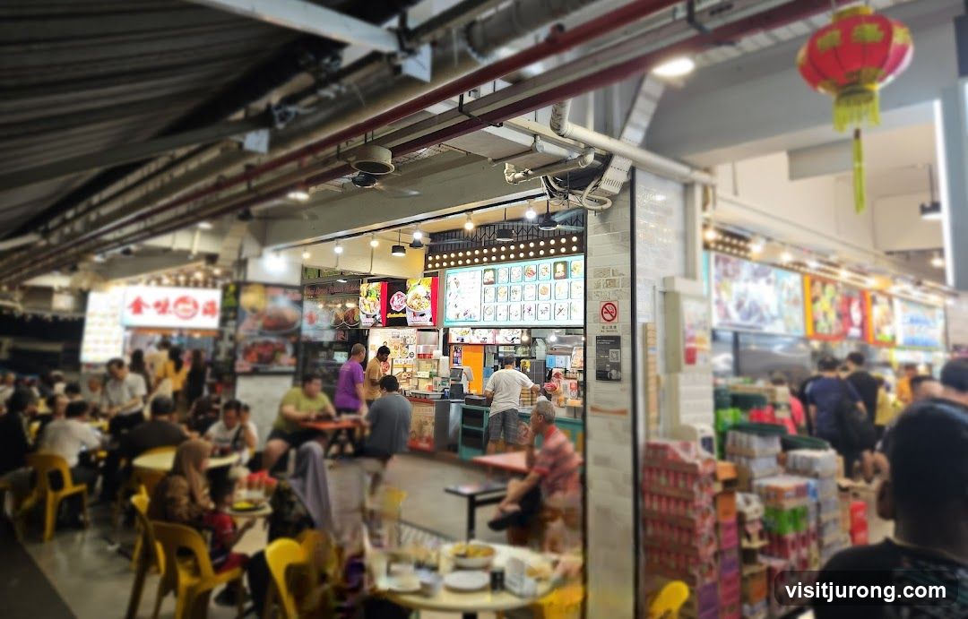 Busy Food Stall with Menu and Customers