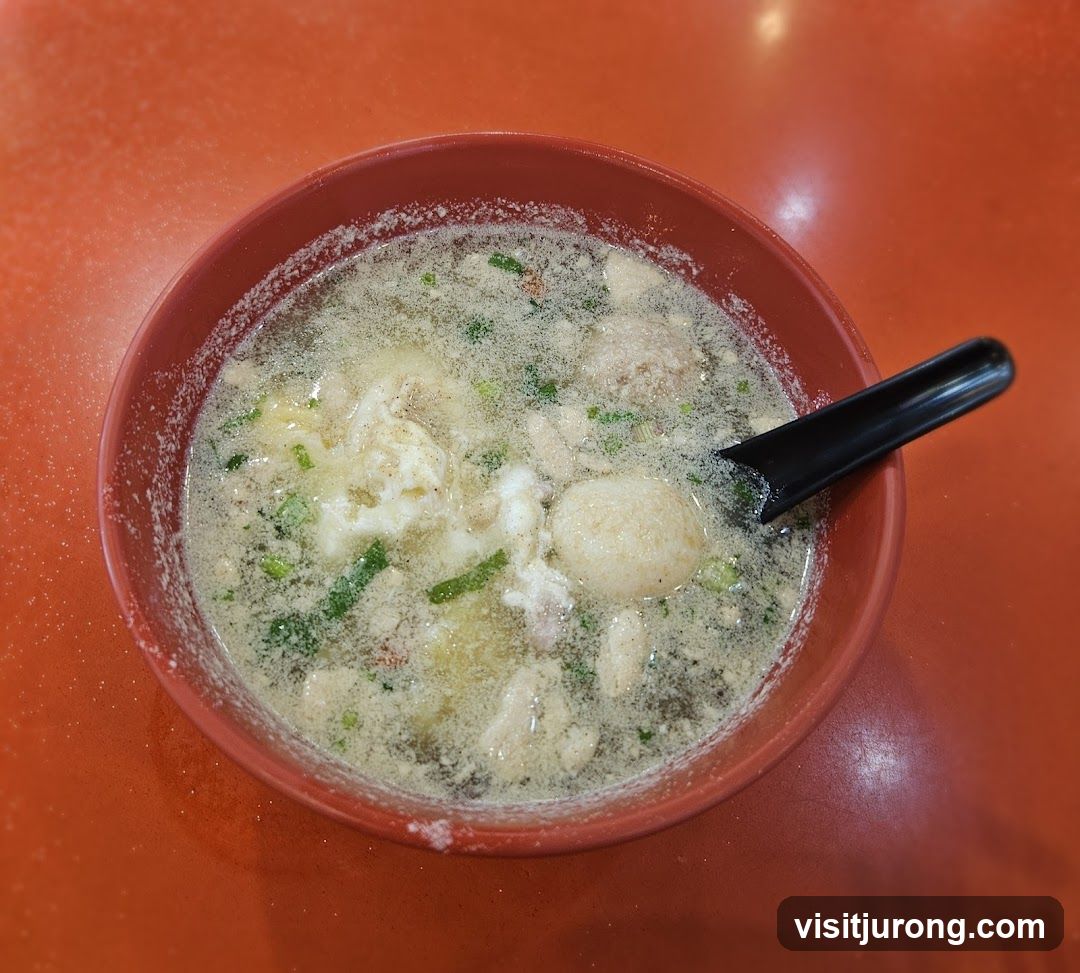 Bowl of Soup with Meatballs and Egg