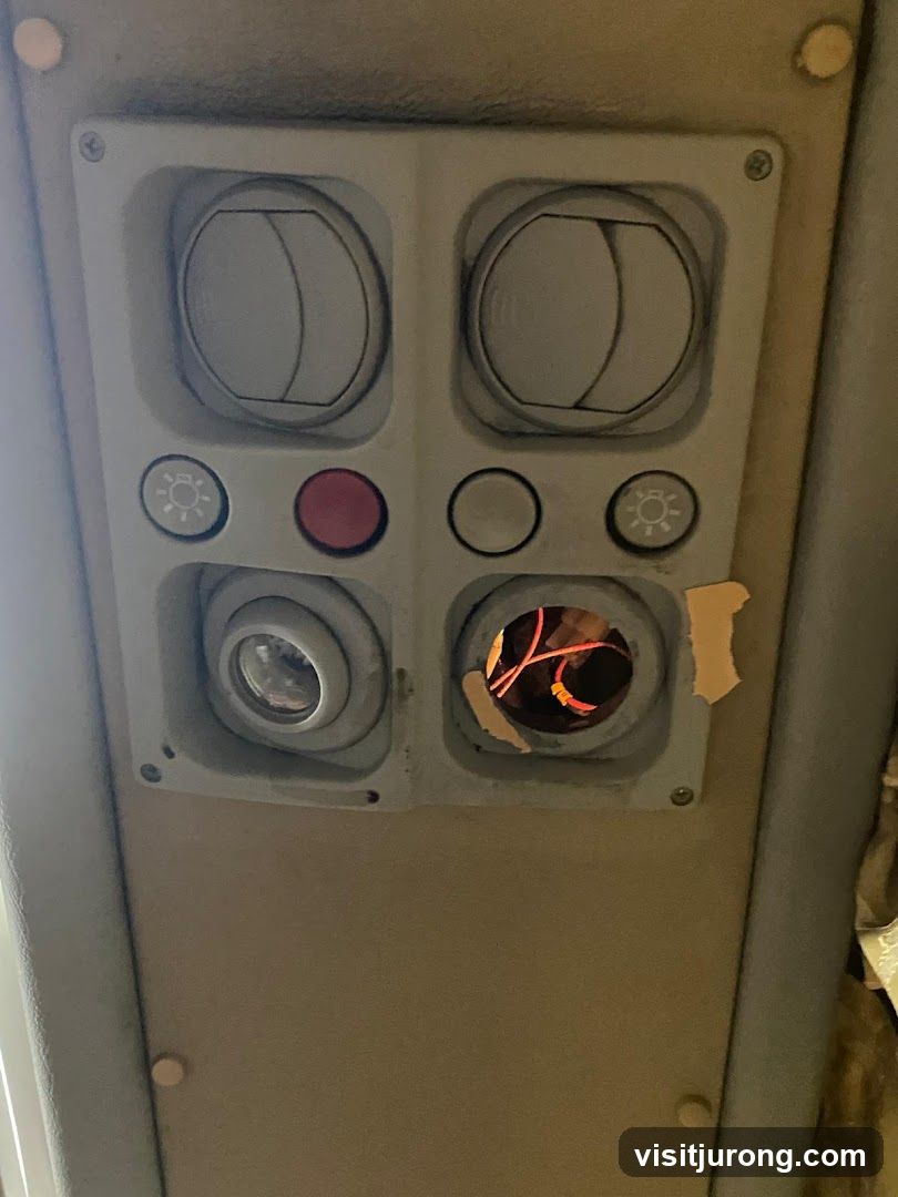 Damaged Ceiling Panel with Exposed Wires