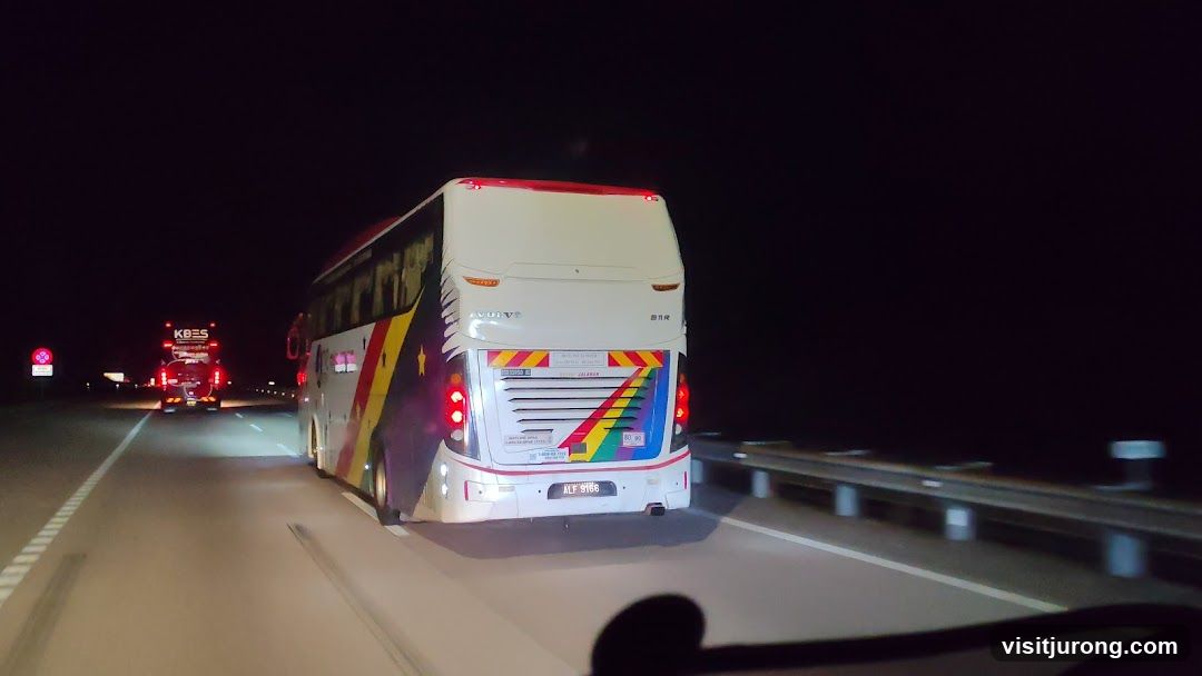 Buses on a highway at night