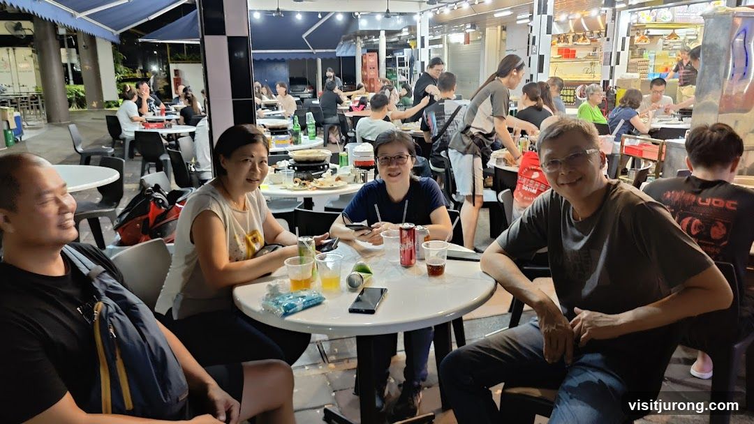 People dining at an outdoor food court