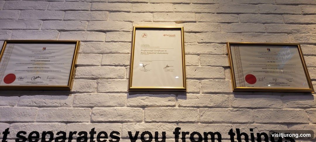 Certificates on a brick wall