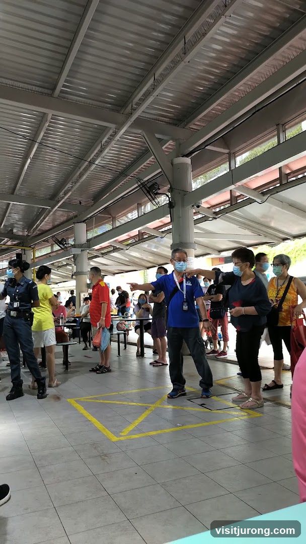 People queuing at an outdoor food court
