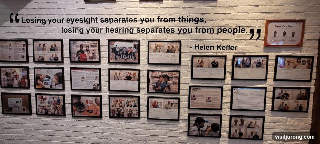 Wall with framed photos and quote