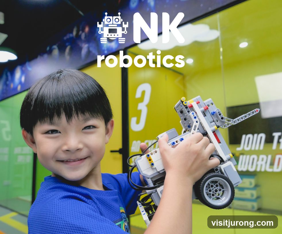 Young boy holding a robot