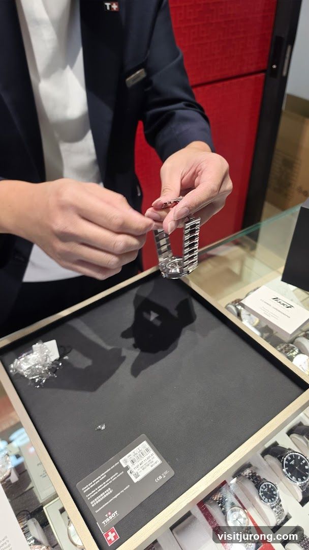 Watchmaker adjusting a watch band