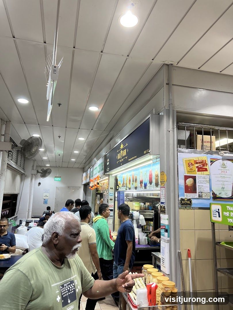 Busy Food Stall with Customers