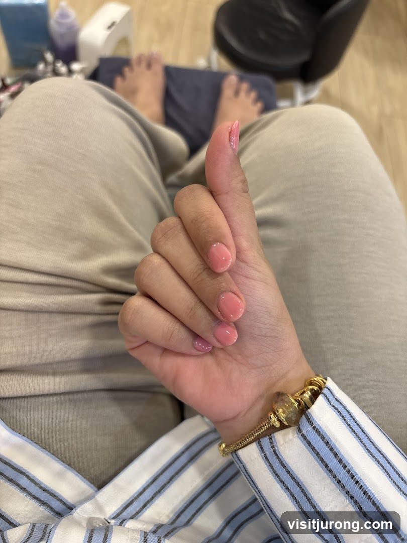 Manicured Hand Giving Thumbs Up