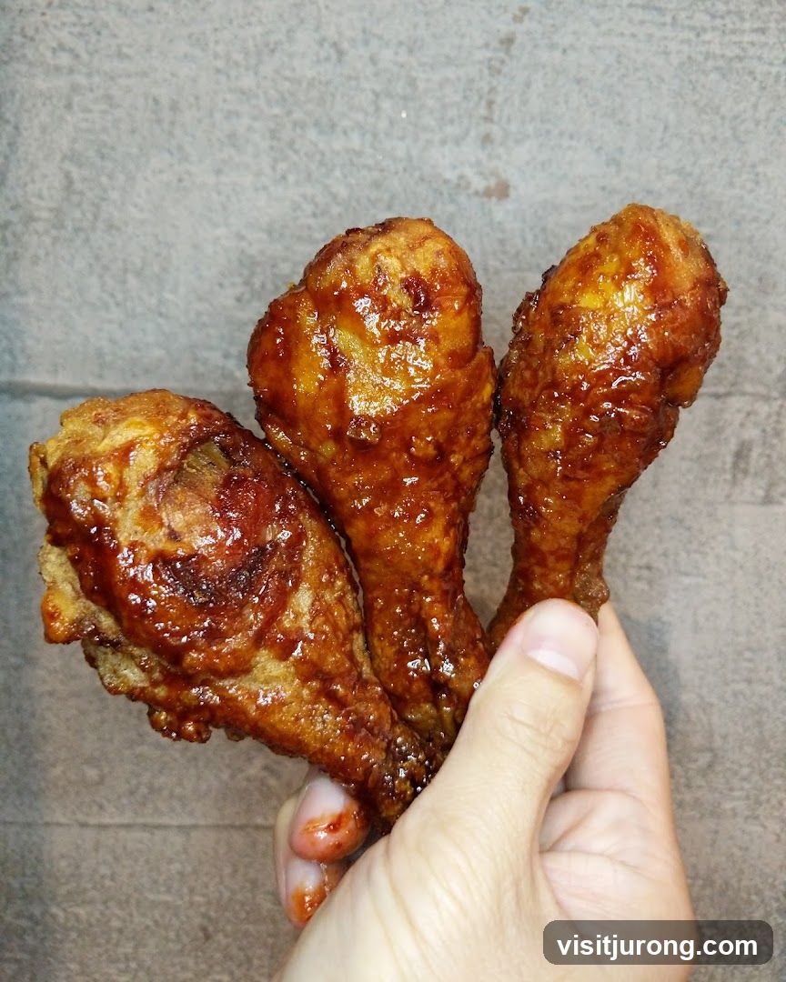Three glazed chicken drumsticks