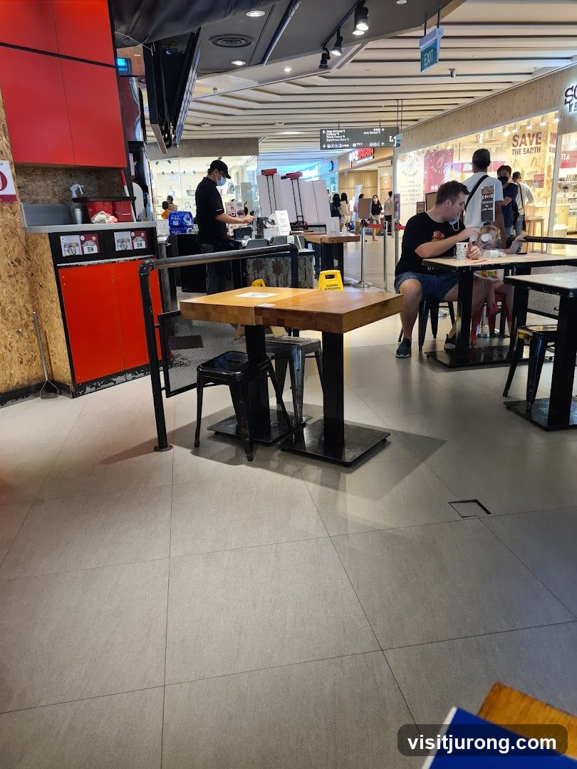Diners at tables in a food court