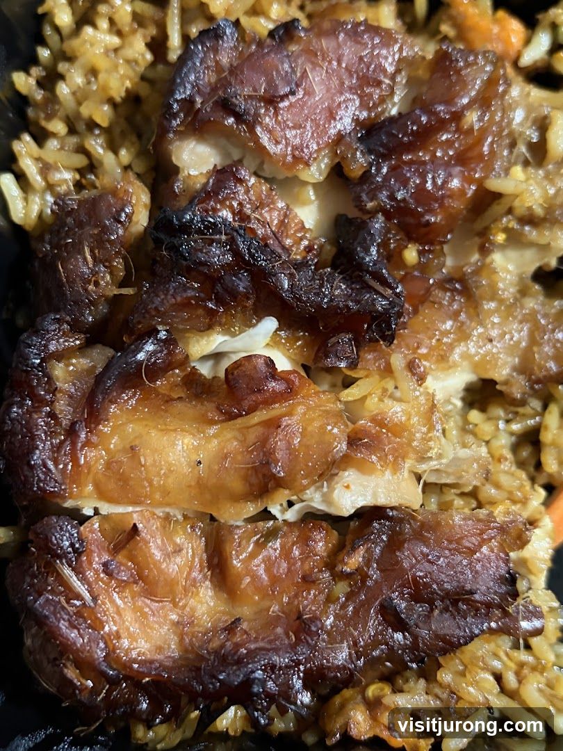 Close-up of roasted chicken and rice