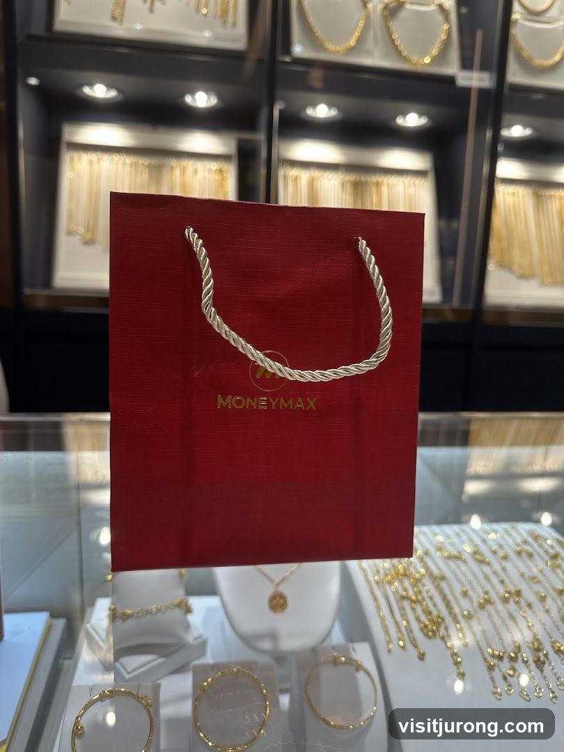 Red Gift Bag with "MONEYMAX" Logo