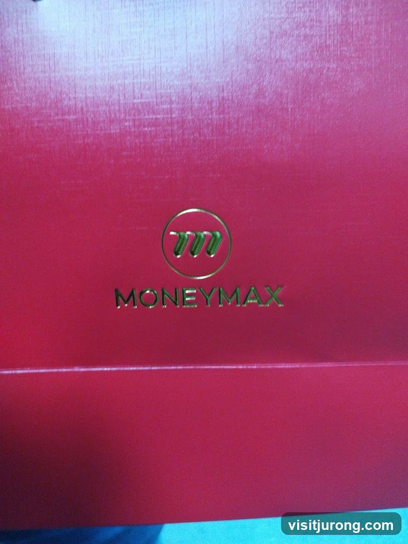MoneyMax Logo on Red Surface