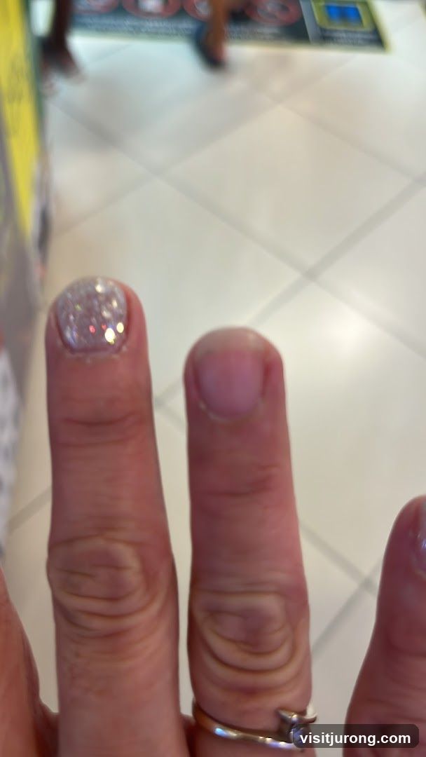 Close-up of Fingers with Glitter Nail Polish