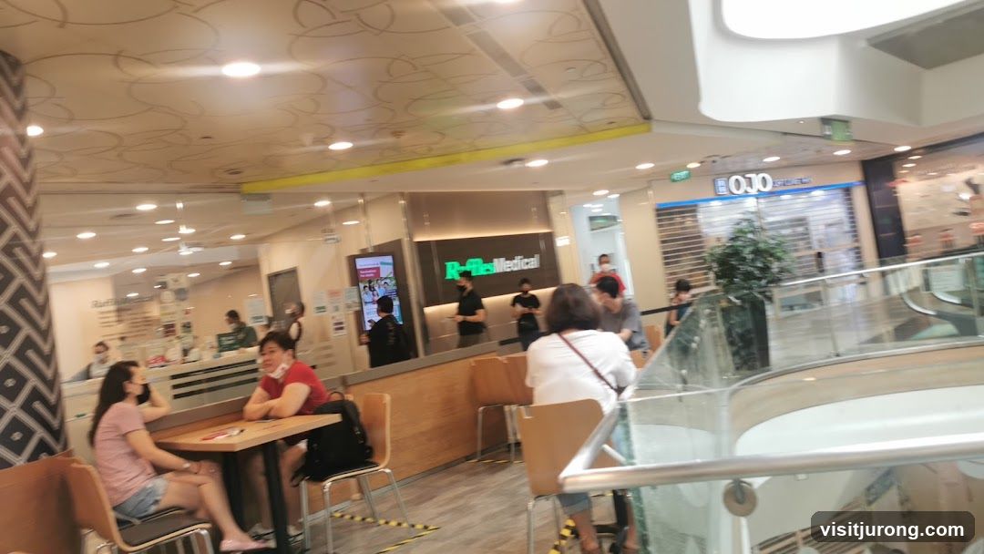 Interior of a mall with shops and seating areas